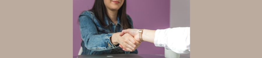 Handshake Across Table